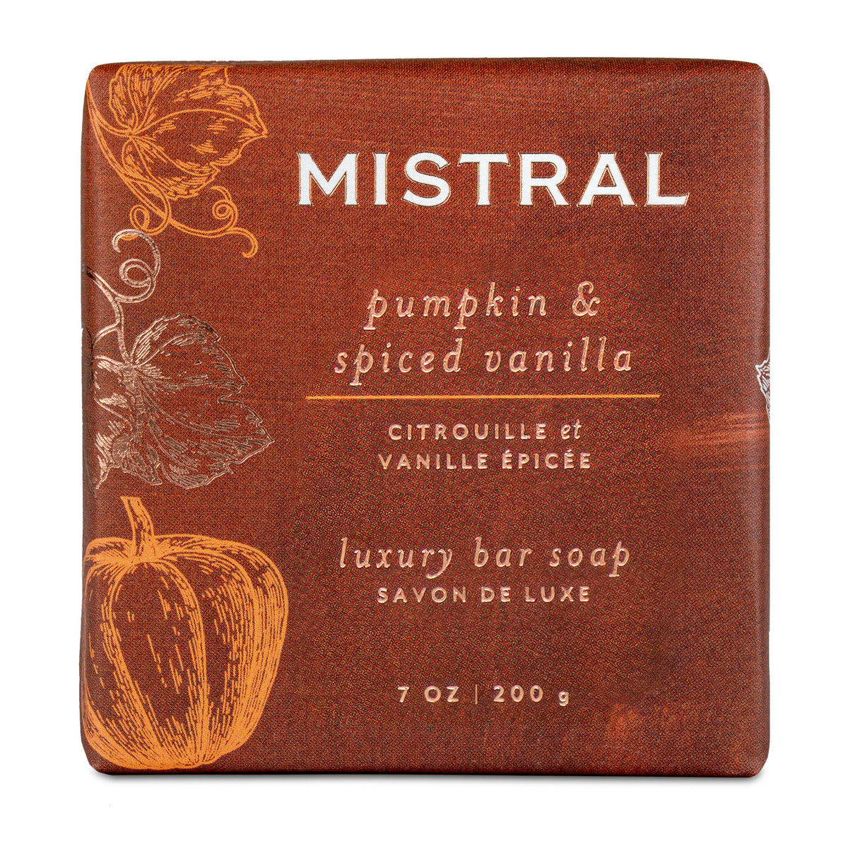 A square bar of luxury soap wrapped in textured brown paper packaging labeled 'MISTRAL pumpkin & spiced vanilla' with orange pumpkin illustrations and white text.