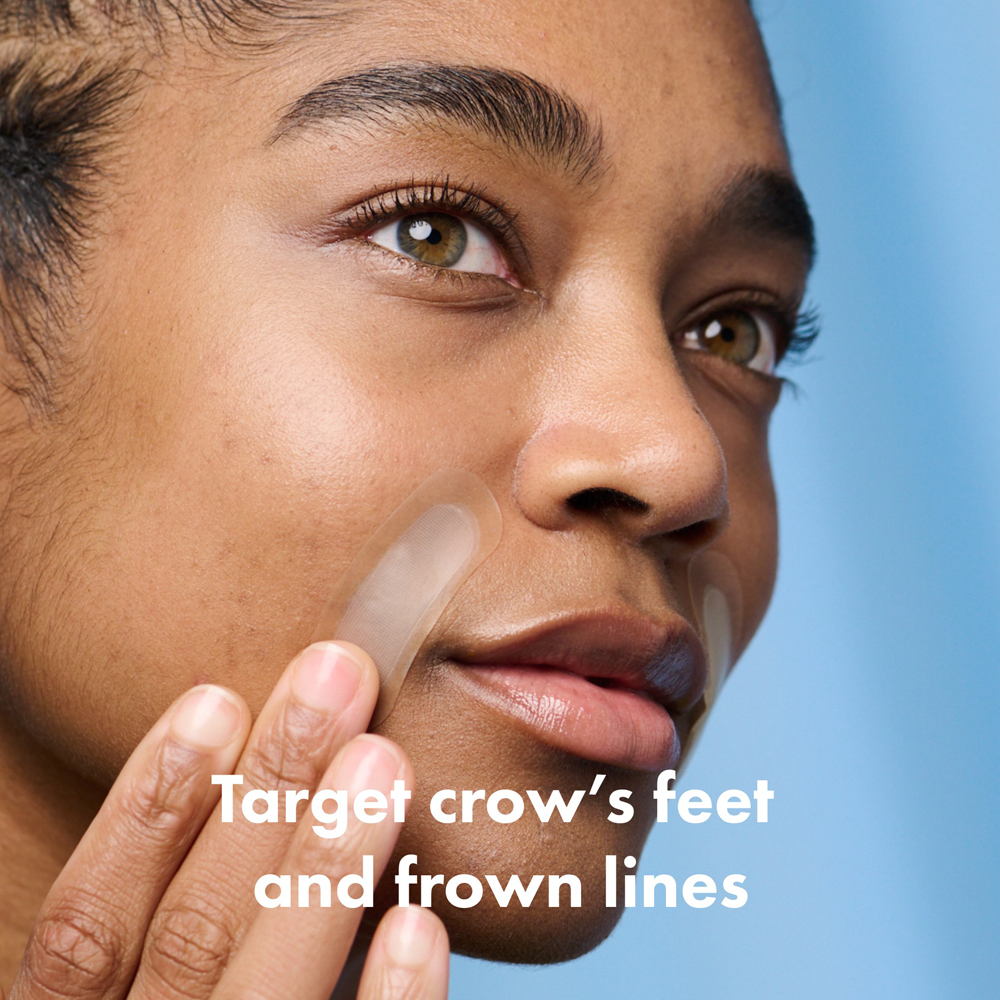 Person applying cream to face with text 'Target crow's feet and frown lines' on a blue background