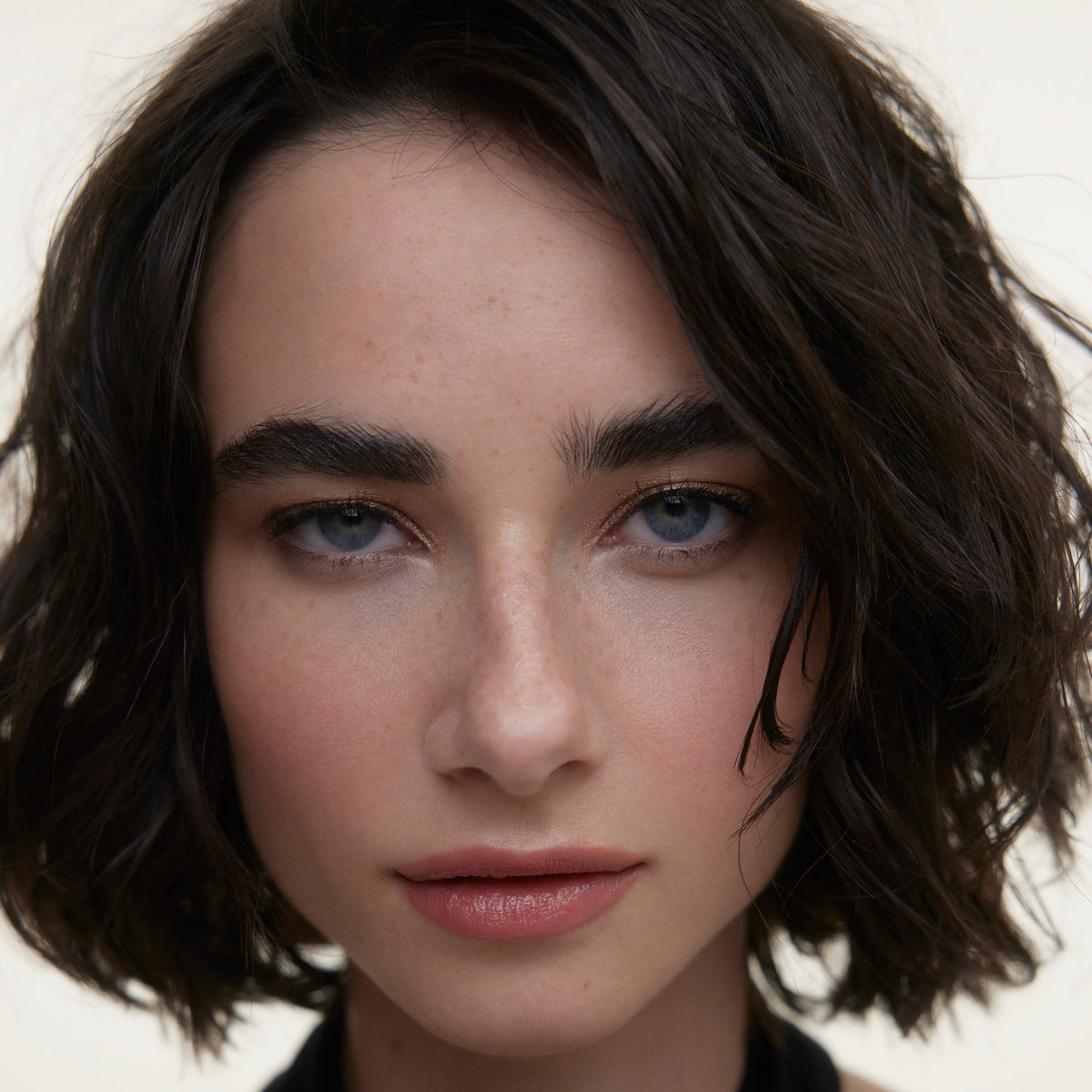 Closeup of a woman's face wearing Wonderblush makeup.