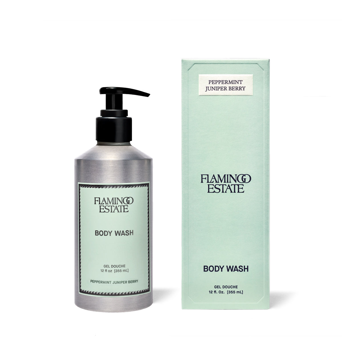A bottle of Flamingo Estate Body Wash with a black pump next to its mint green packaging box, labeled Peppermint Juniper Berry, on a white background.