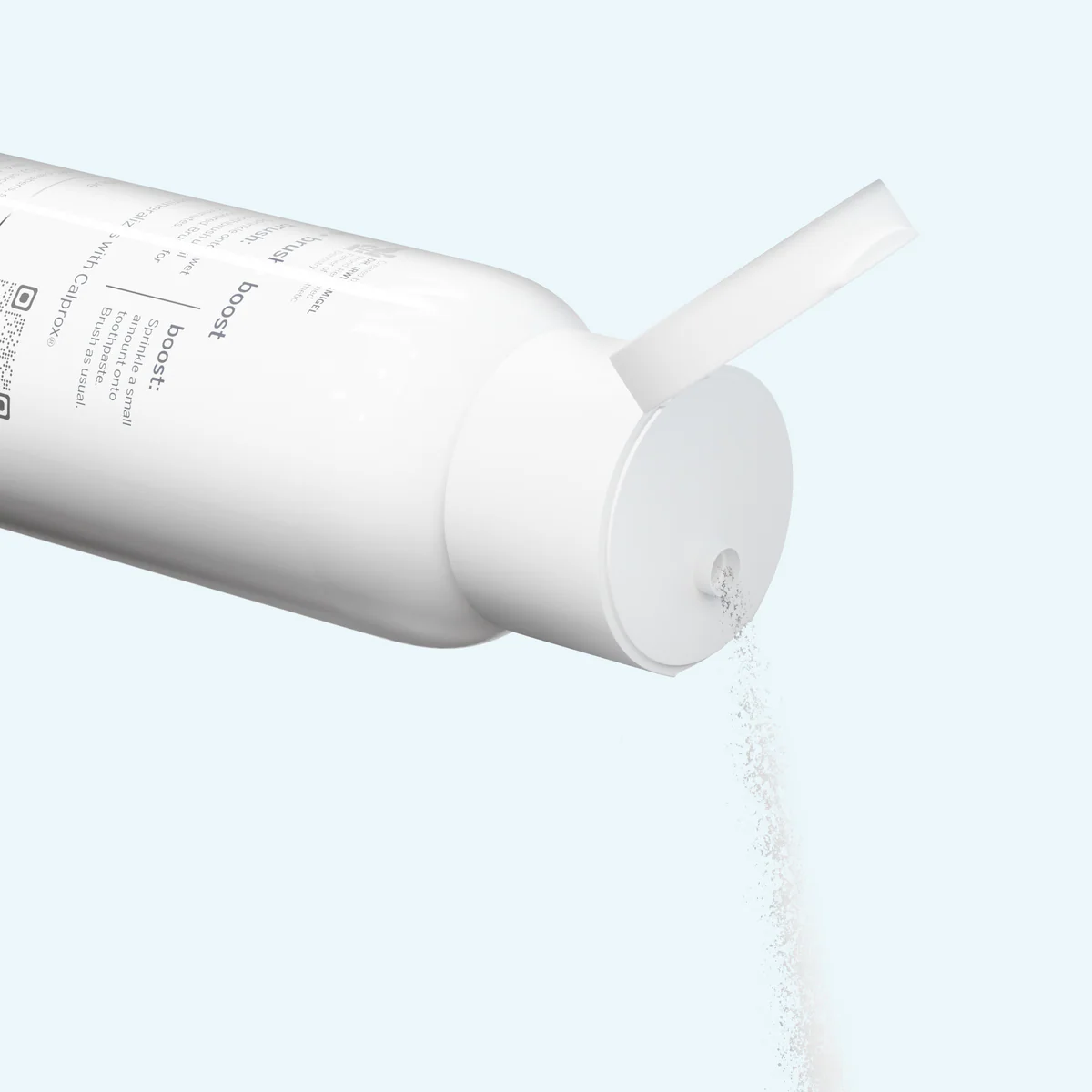 White bottle with a nozzle dispensing a white powder on a light blue background