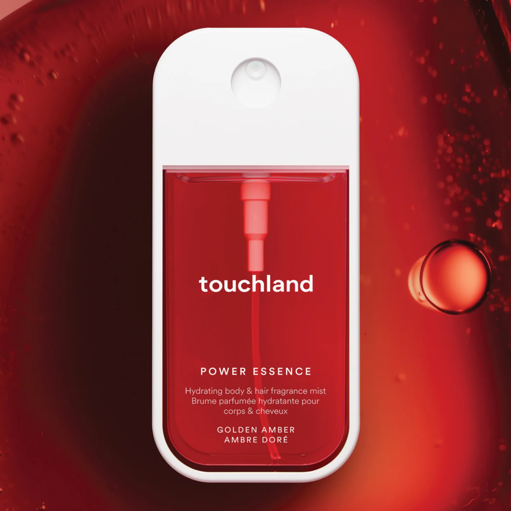Touchland power essence product on a red background