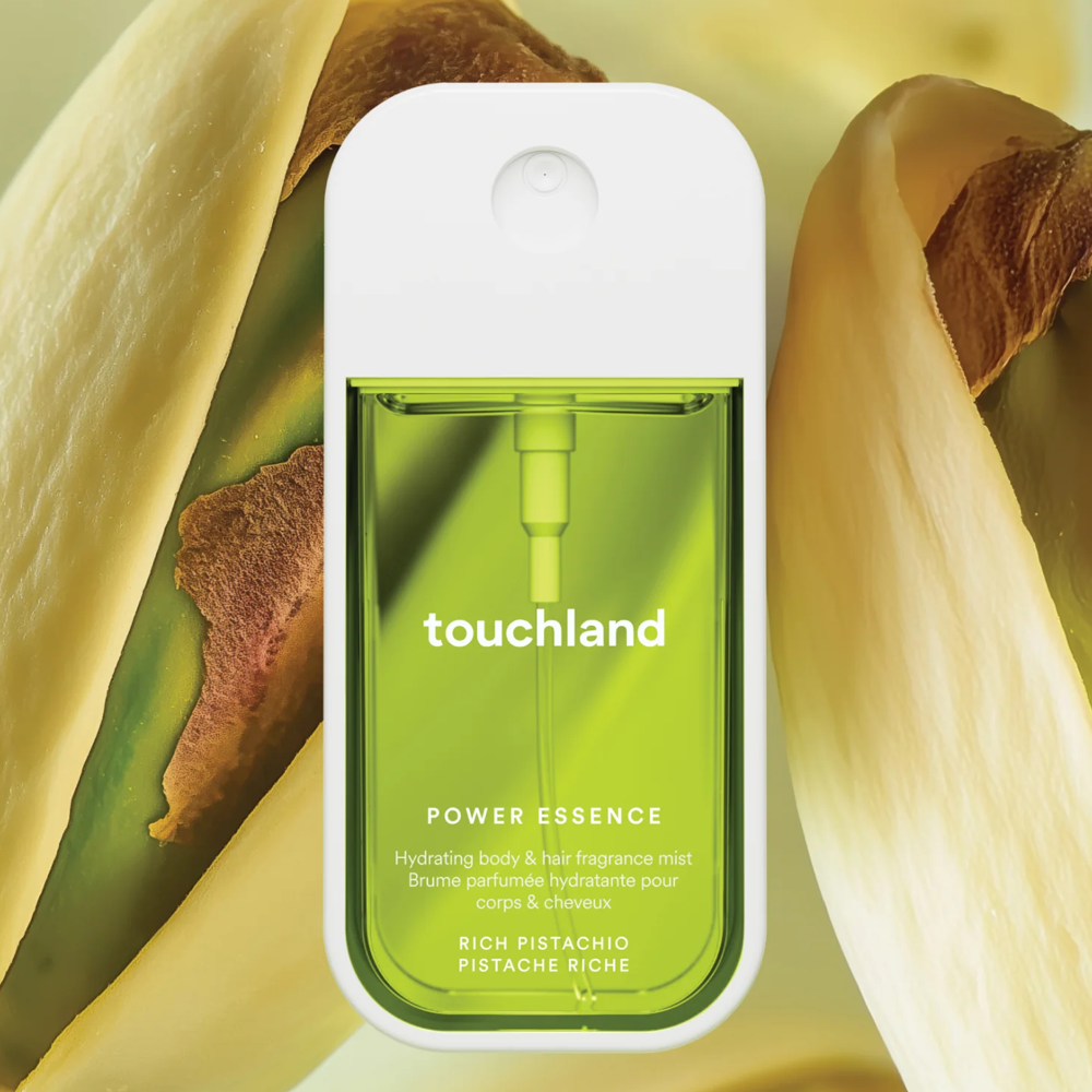 Touchland Power Essence packaging with pistachio shell background