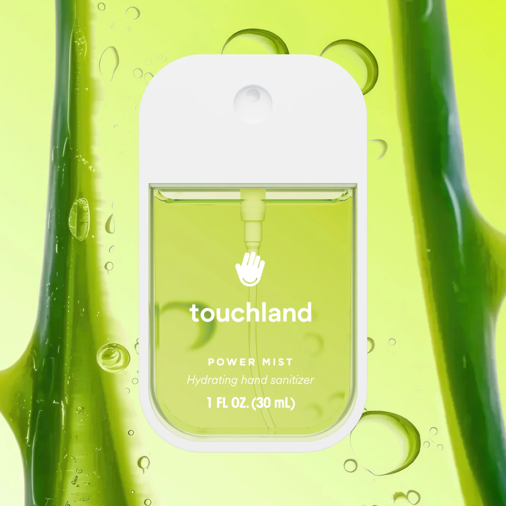 Touchland power mist hydrating hand sanitizer packaging on a green aloe background