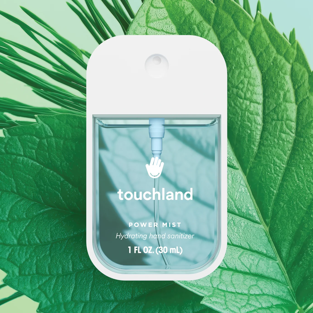 Touchland power mist hydrating hand sanitizer packaging on a mint leaf background