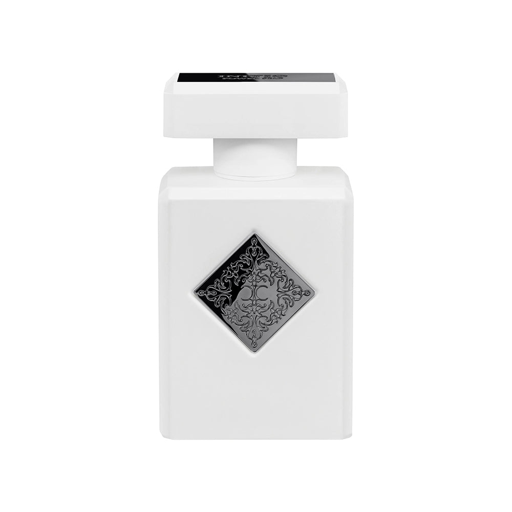 White perfume bottle with decorative cap on a white background