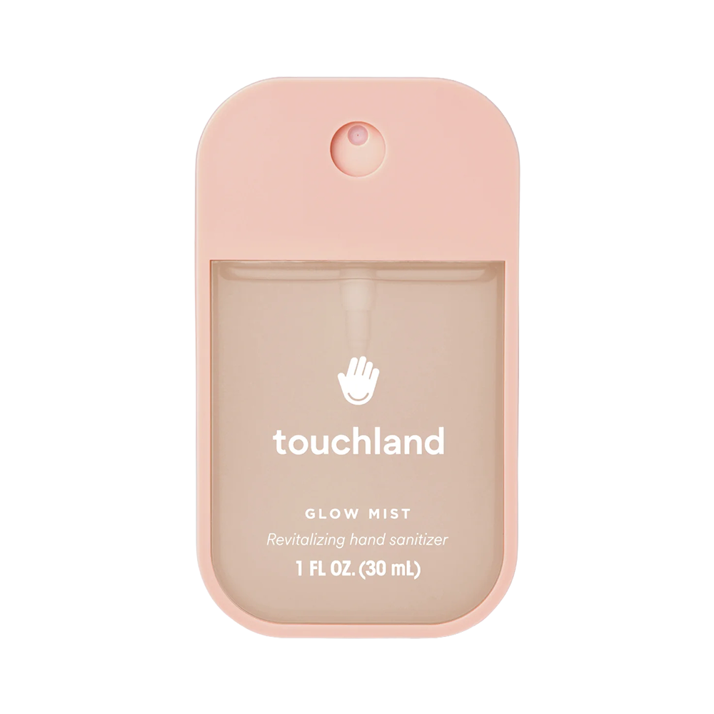 Pink hand sanitizer bottle with 'touchland' branding on a white background