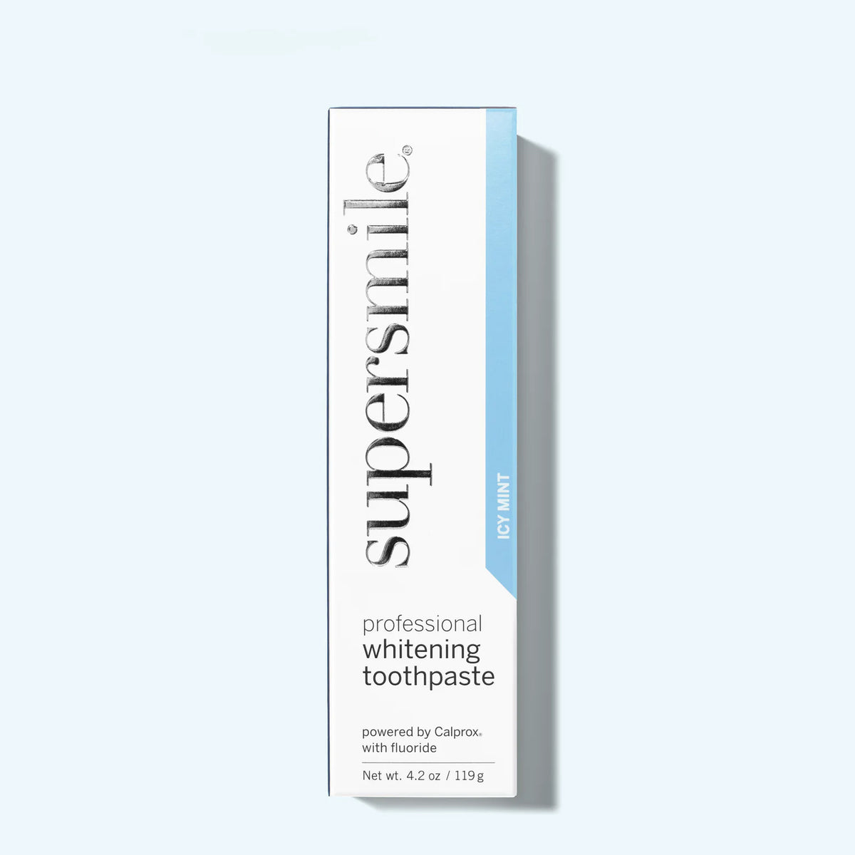 Supersmile professional whitening toothpaste box on a light gray background