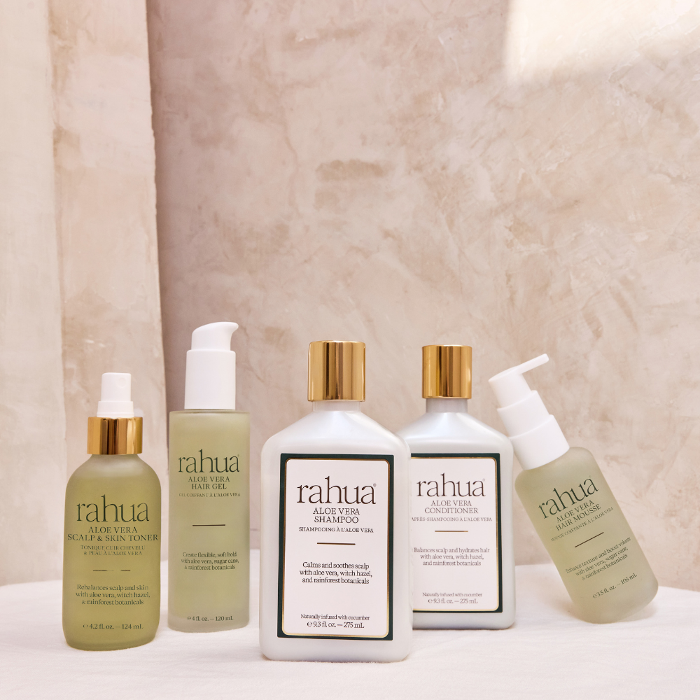 Set of Rahua hair care products on a neutral background