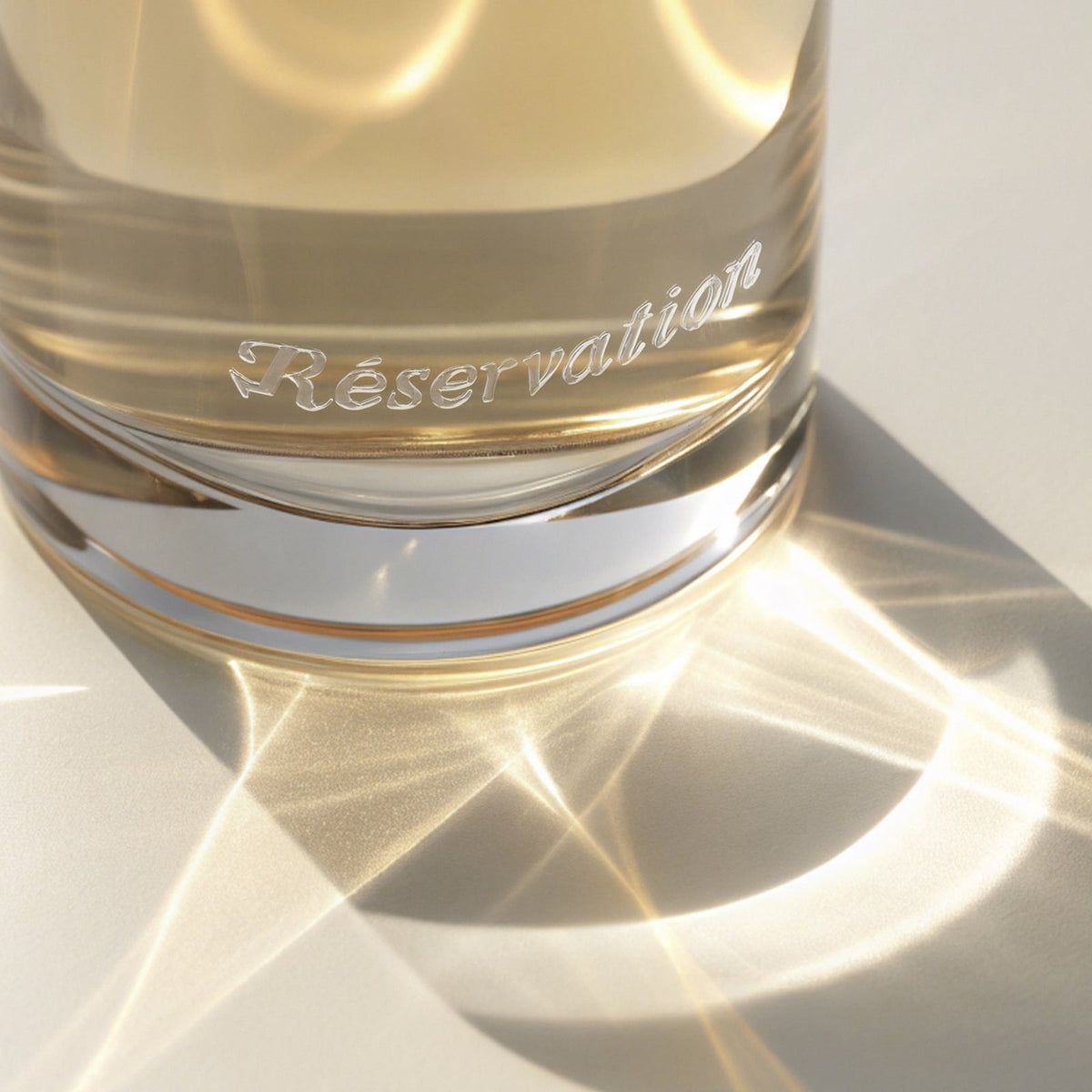 Light reflecting off of a Reservation perfume bottle. 