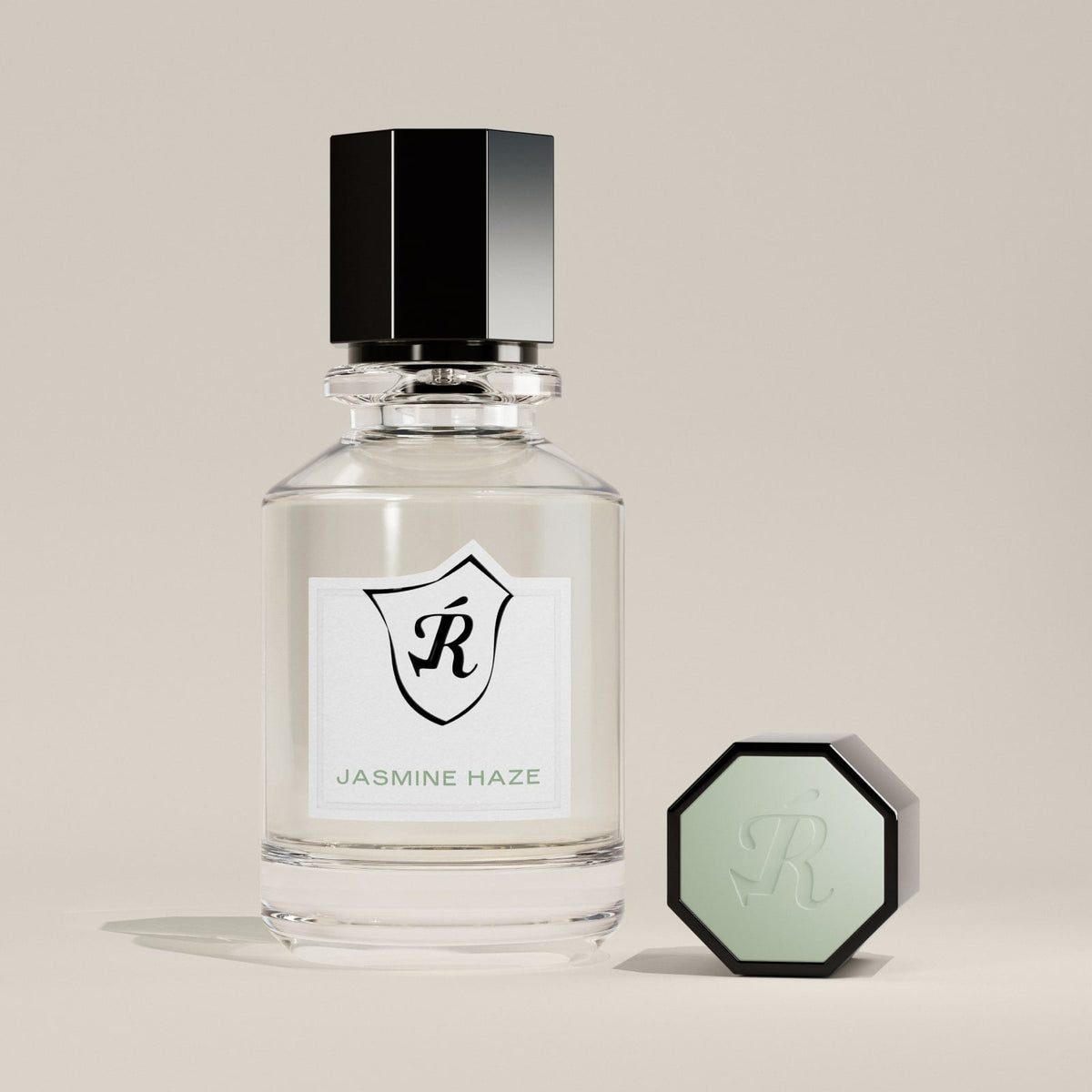 Perfume bottle labeled 'Jasmine Haze' with a hexagonal cap on a beige background