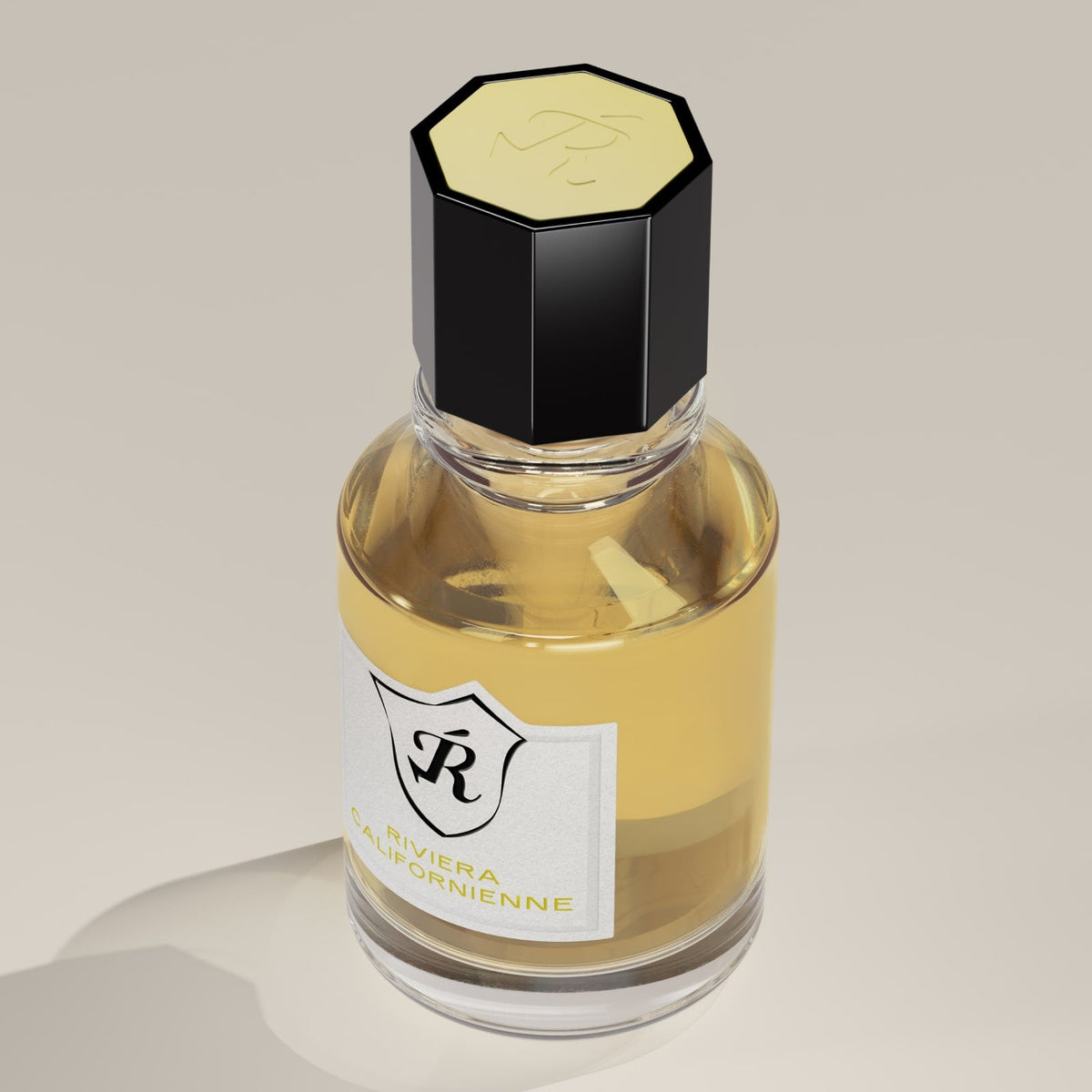 Glass bottle with black hexagonal cap on a beige background