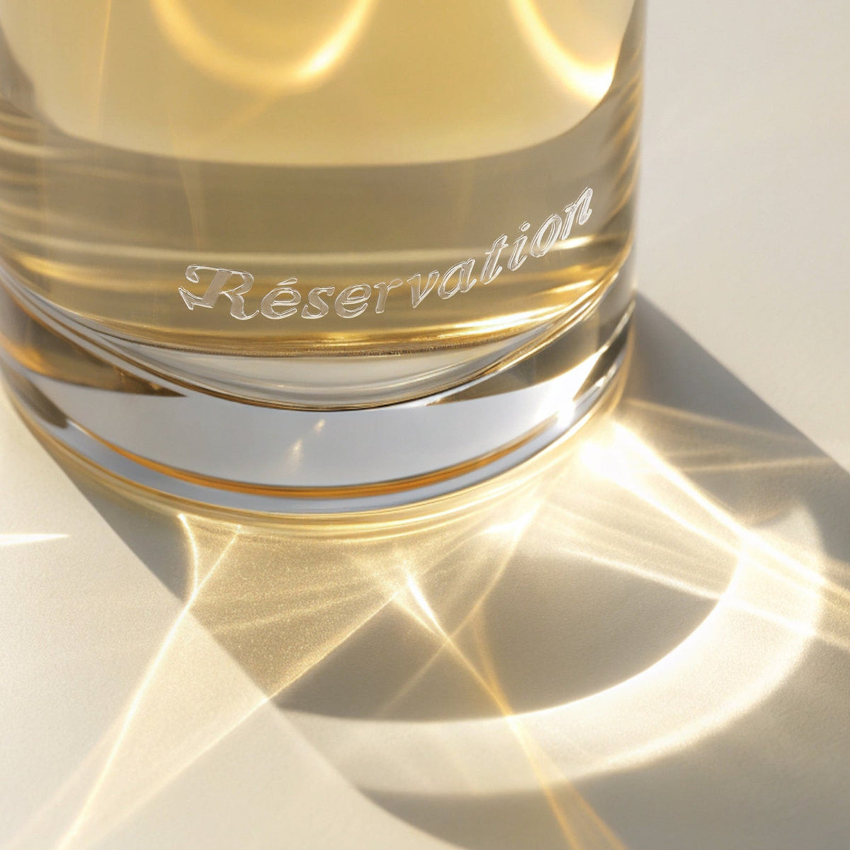 Light reflecting off a Reservation perfume bottle.