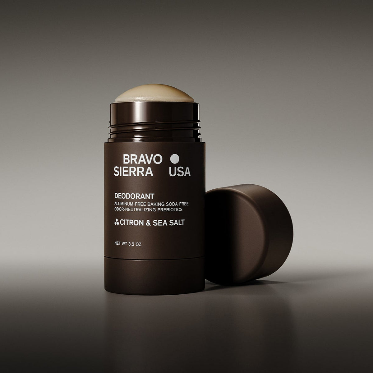 Open tube of Bravo Sierra Citron & Sea Salt Deodorant on a reflective surface in front of a gray background.
