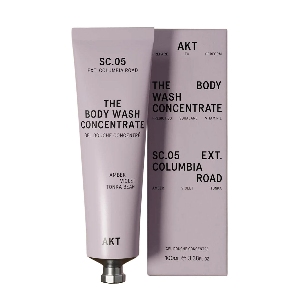 Lilac colored tube of AKT's Body Wash Concentrate in their Columbia Road Scent next to it's Lilac colored packaging box. 