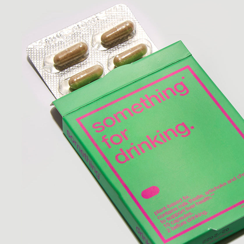 A green and pink package of 'something for drinking' containing dietary supplements for liver health.