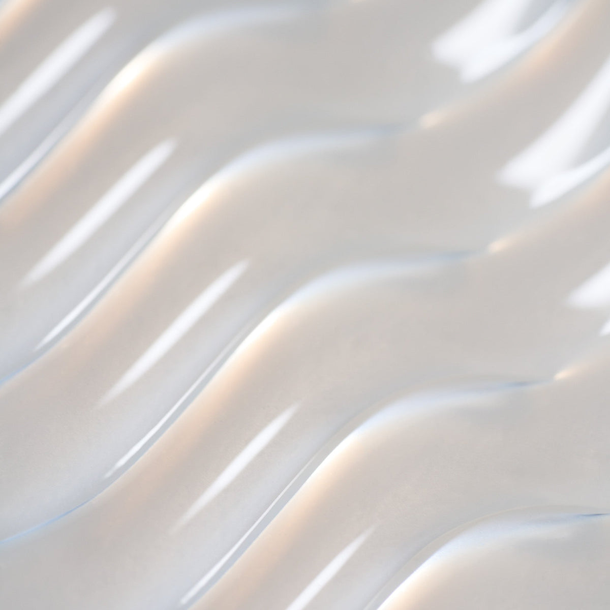 Oribe Supershine Hydrating Shampoo product texture closeup.