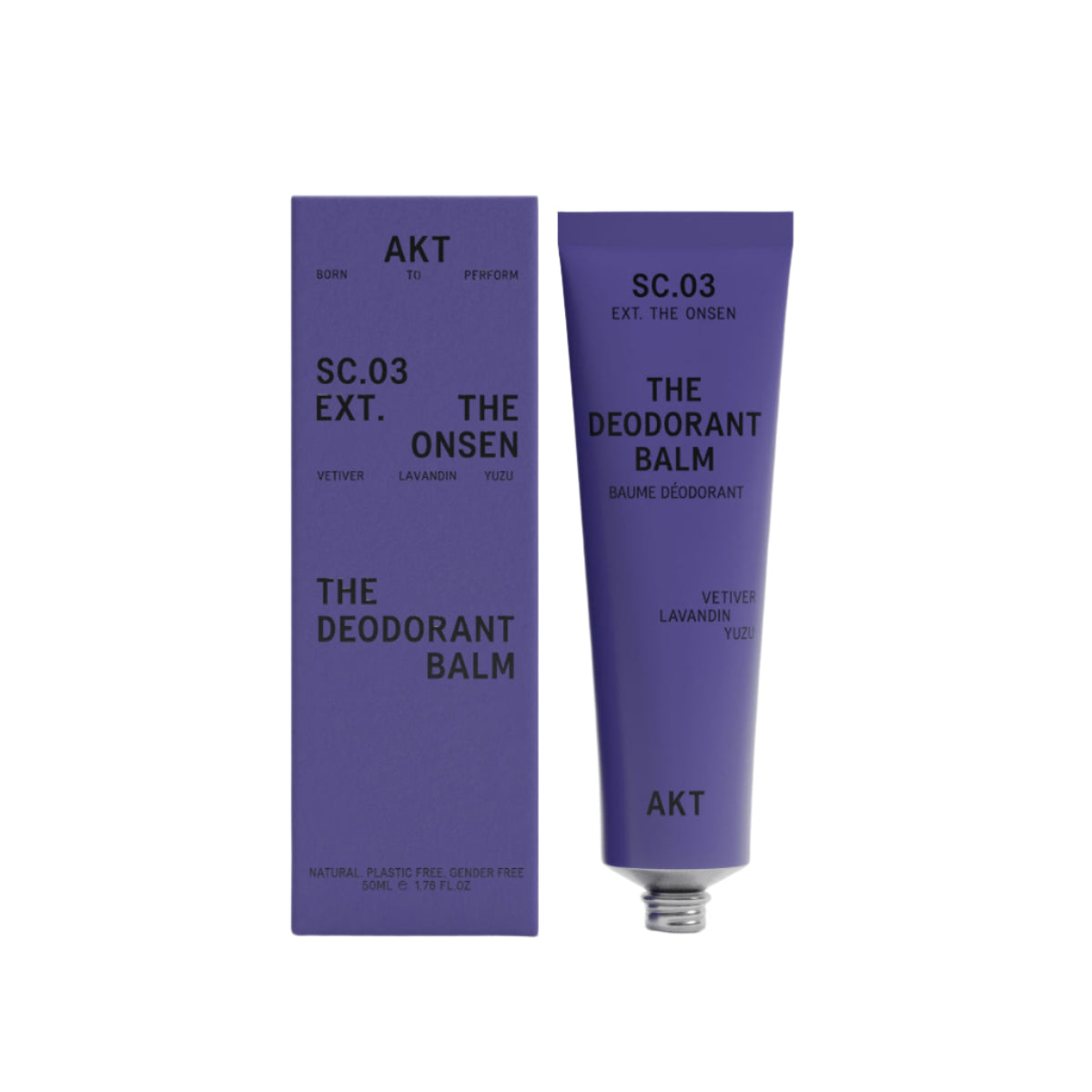 AKT The Onsen scented Deodorant Balm in a dark purple tube next to a dark purple product box on a white background. 