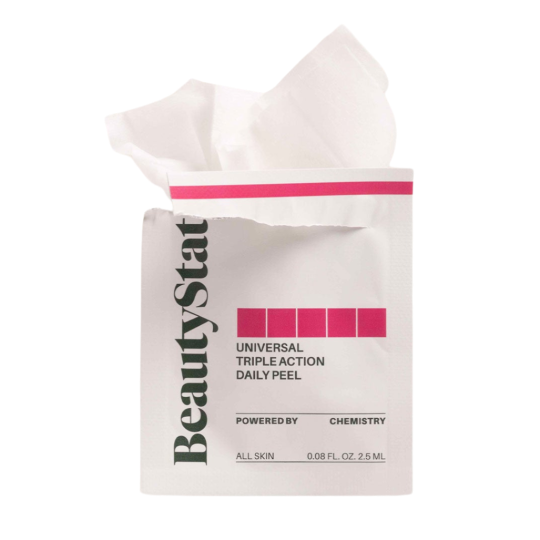 A package of BeautyStat Universal Triple Action Daily Exfoliating Peel Pads with one pad partially extended from the package.