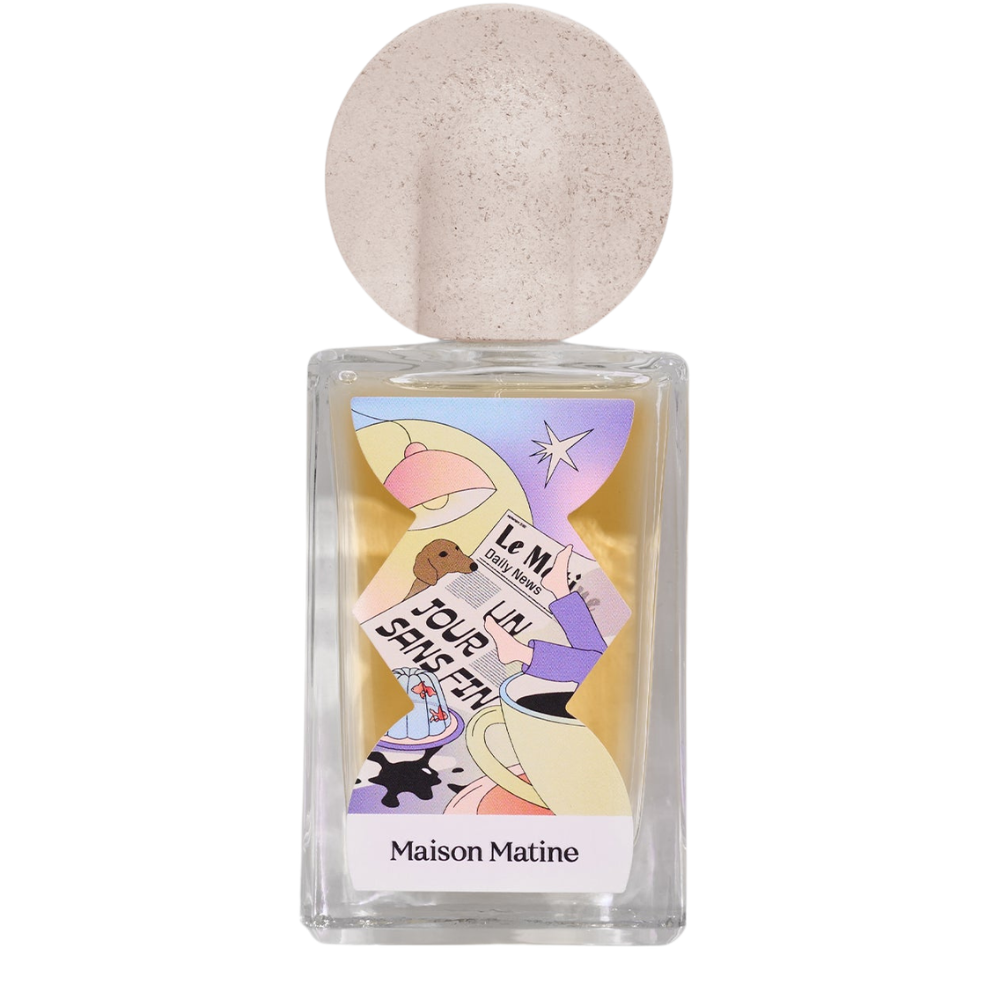 Perfume bottle with colorful label featuring a woman and text on a white background