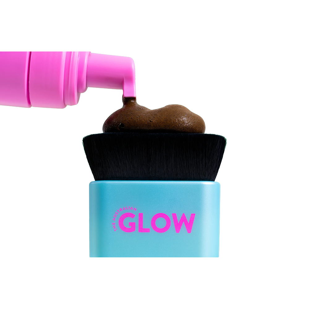 Blue container labeled 'GLOW' with pink text, black brush, and pink lid on a white background