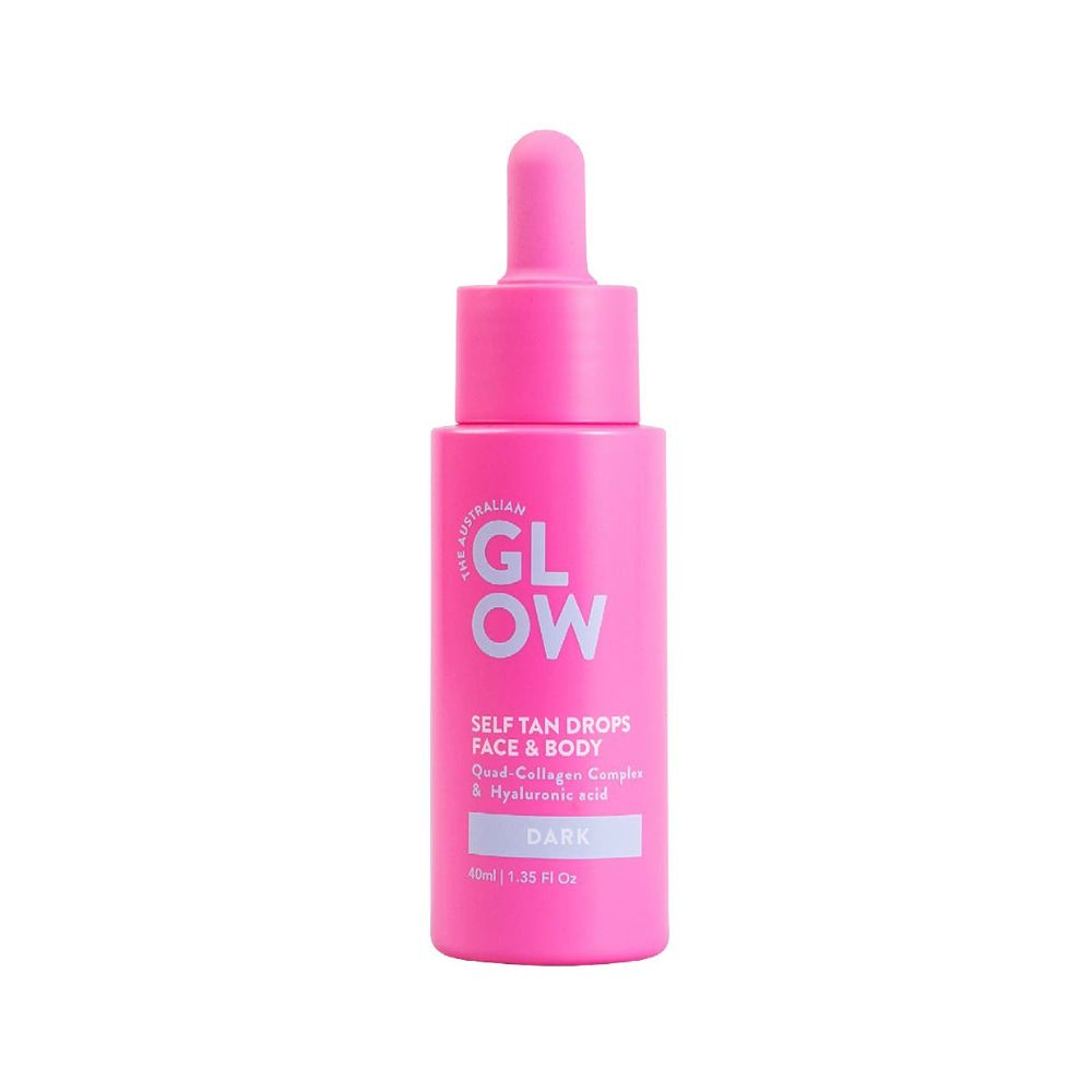 Pink bottle of 'GLOW' self-tan drops on a white background
