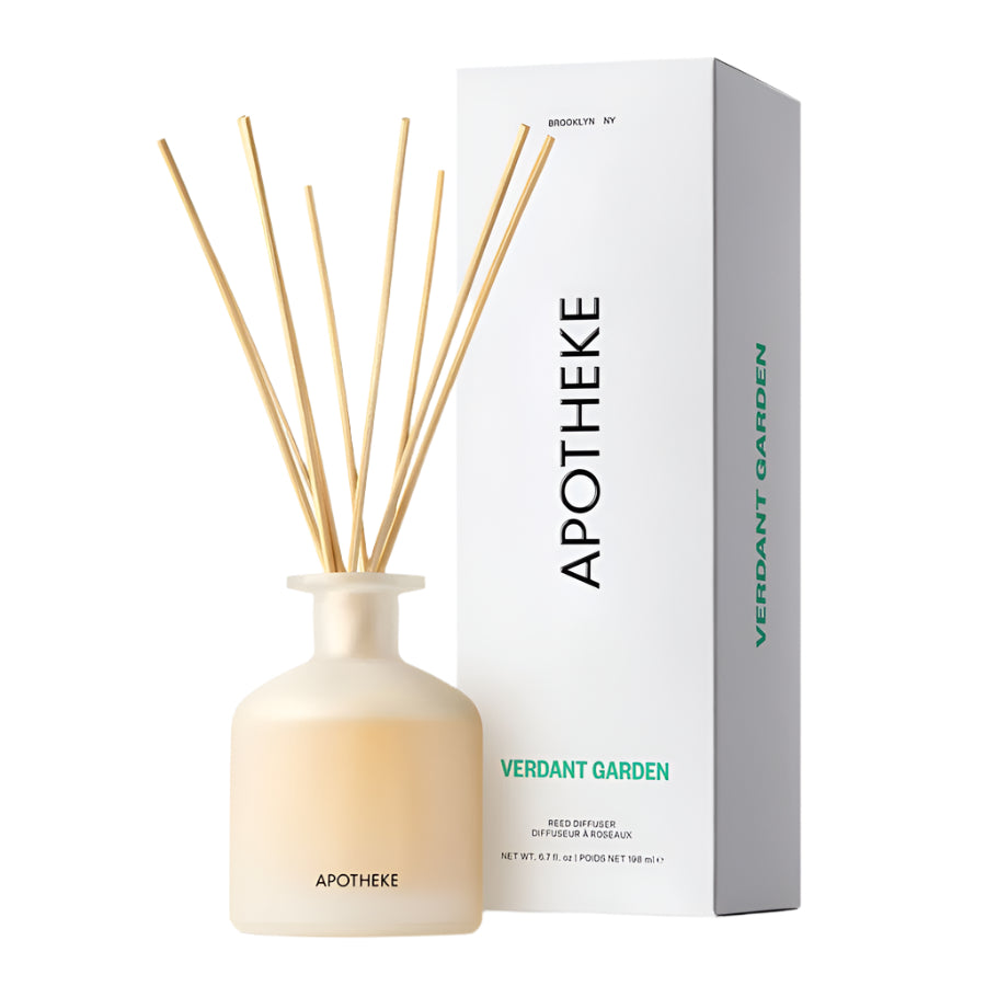 Apotheke Verdant Garden reed diffuser with a clear bottle, beige liquid, and brown reed sticks, next to its white packaging box with green text.