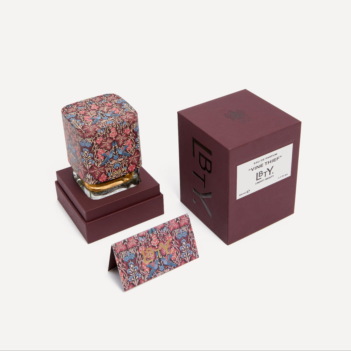 Decorative item with floral design in a box on a white background