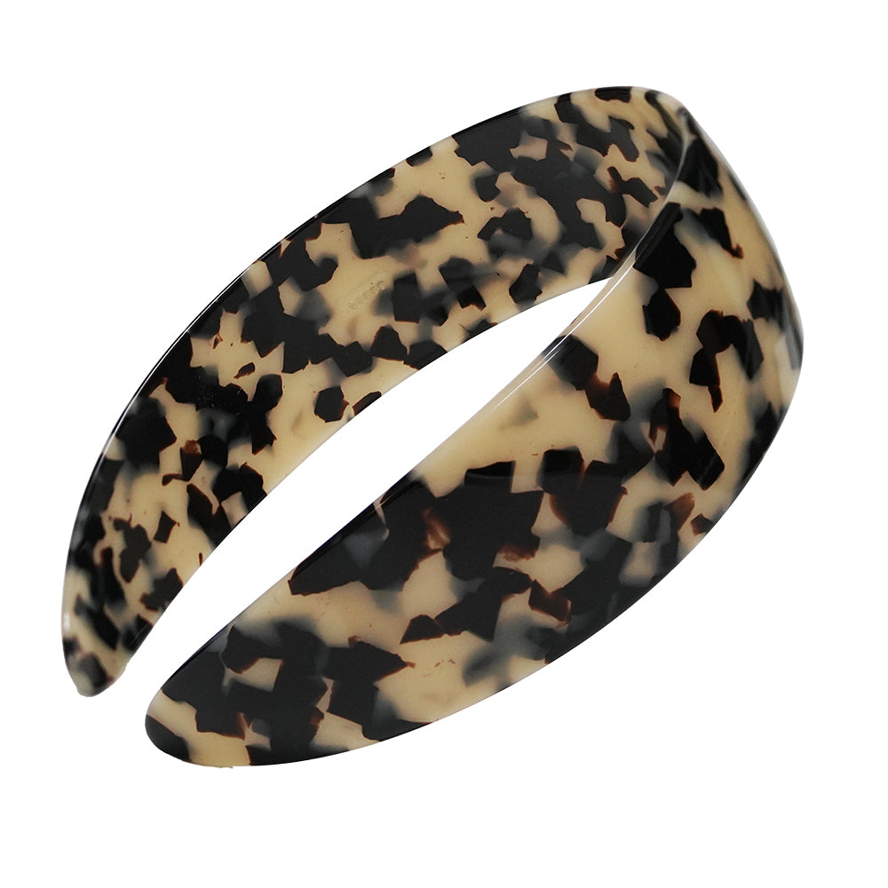 Beige Spotted Charles Wahba headband on a white background.