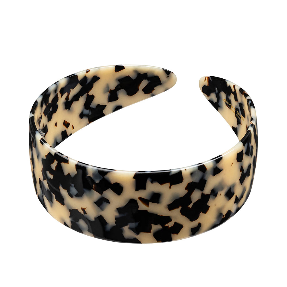 Beige Spotted Charles Wahba headband on a white background.