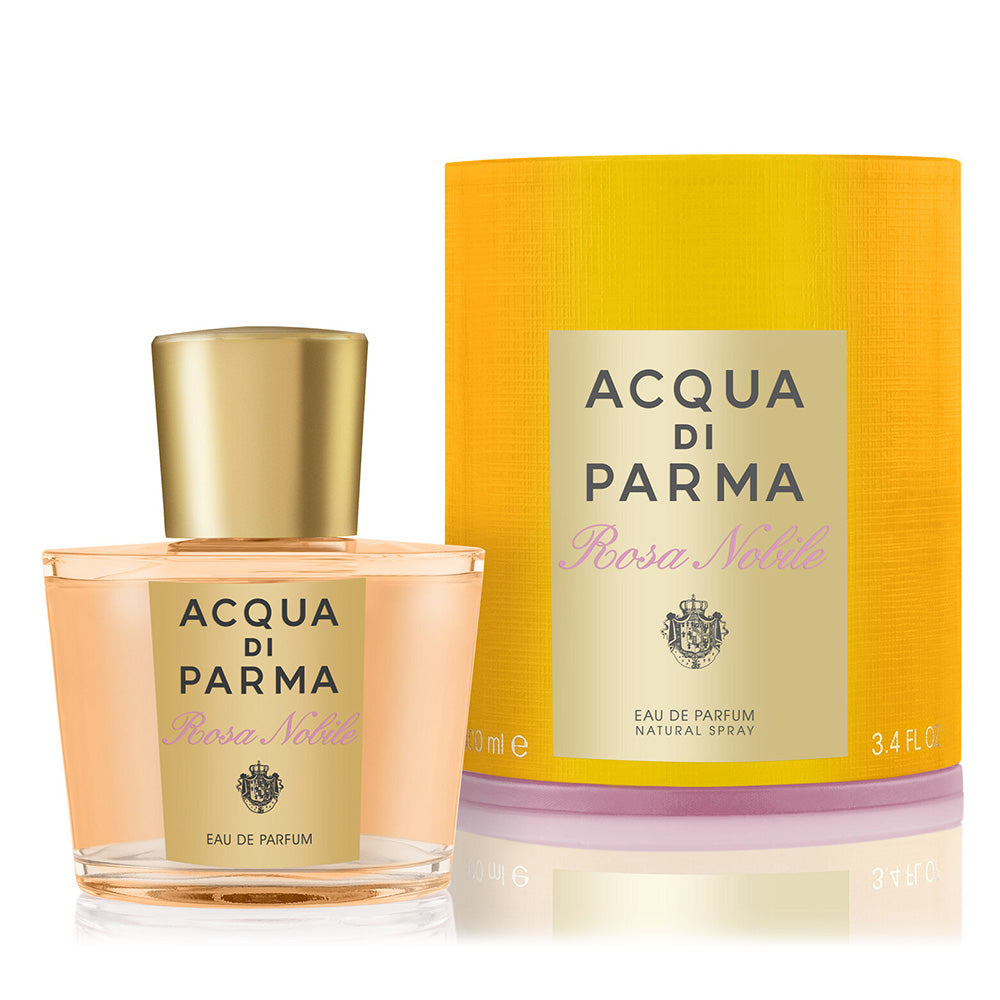 Acqua di parma Rosa Nobile Eau de Parfum bottle on white background with signature cylindrical box packaging directly in back to the right of the bottle.