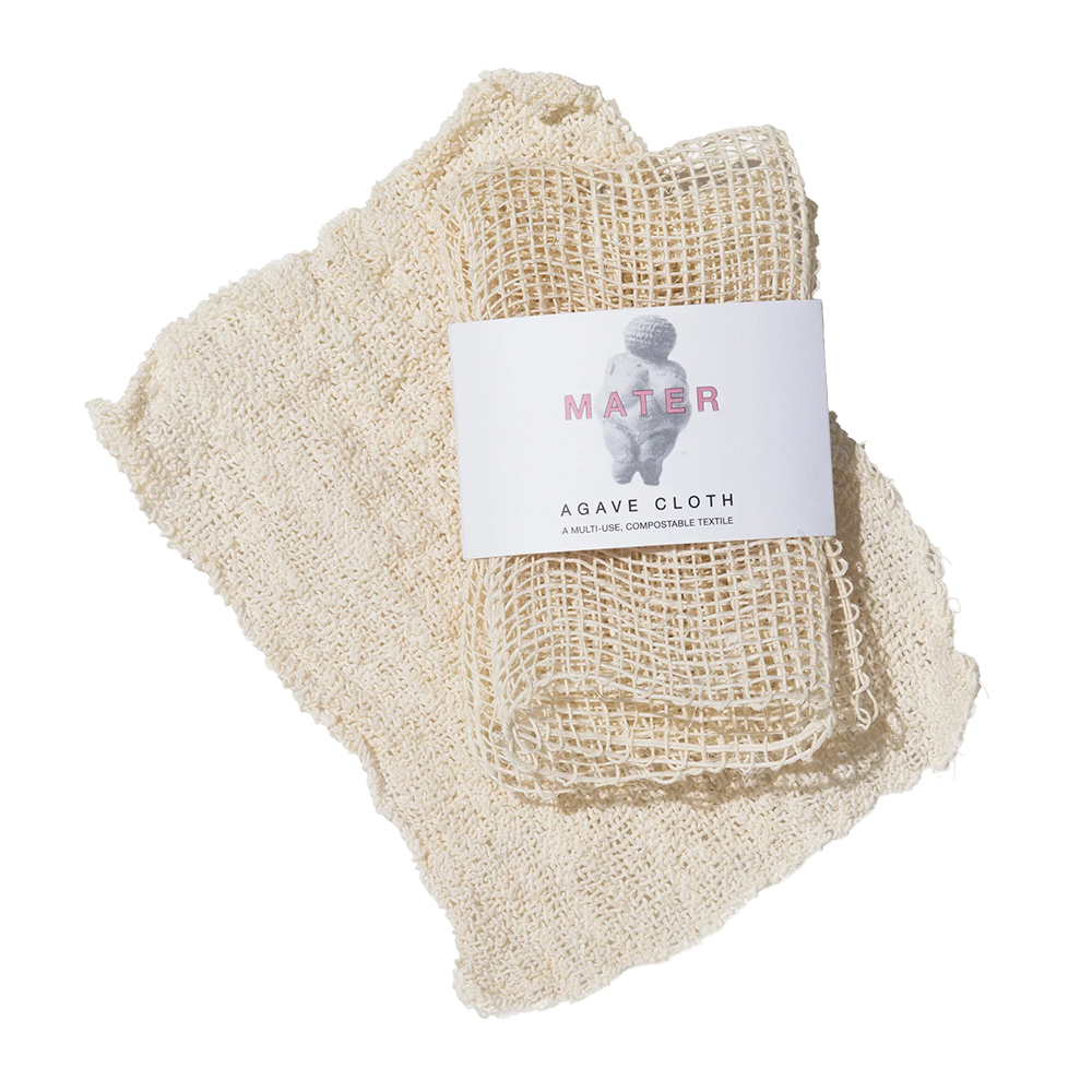 A folded natural beige agave cloth with a white paper label that reads 'MATER AGAVE CLOTH', photographed on a clean white background.