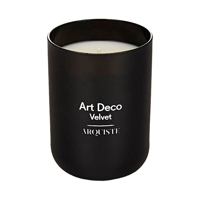 A black Art Deco Velvet candle with white text labeling on the lid.