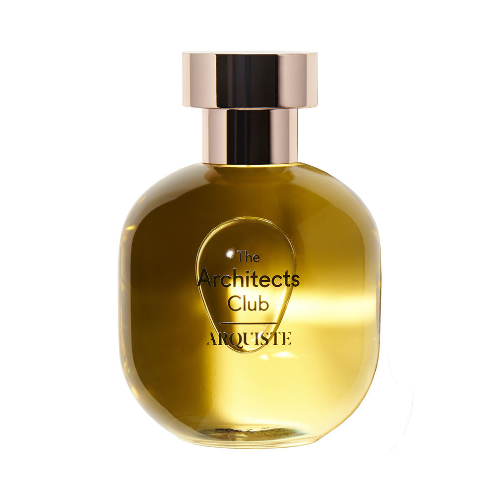 A bottle of 'The Architects Club' eau de parfum by Arquiste, with a clear, amber-colored liquid visible and the brand's name printed on the label.