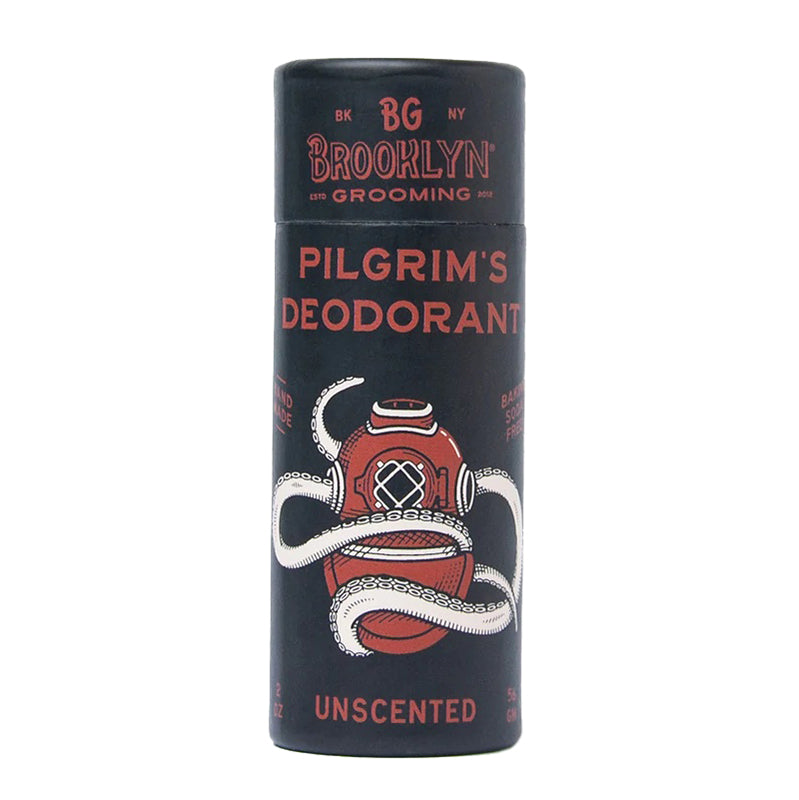 A black cylindrical container of Brooklyn Grooming's Pilgrim's Deodorant with an illustration of a diver and text indicating the product is unscented.