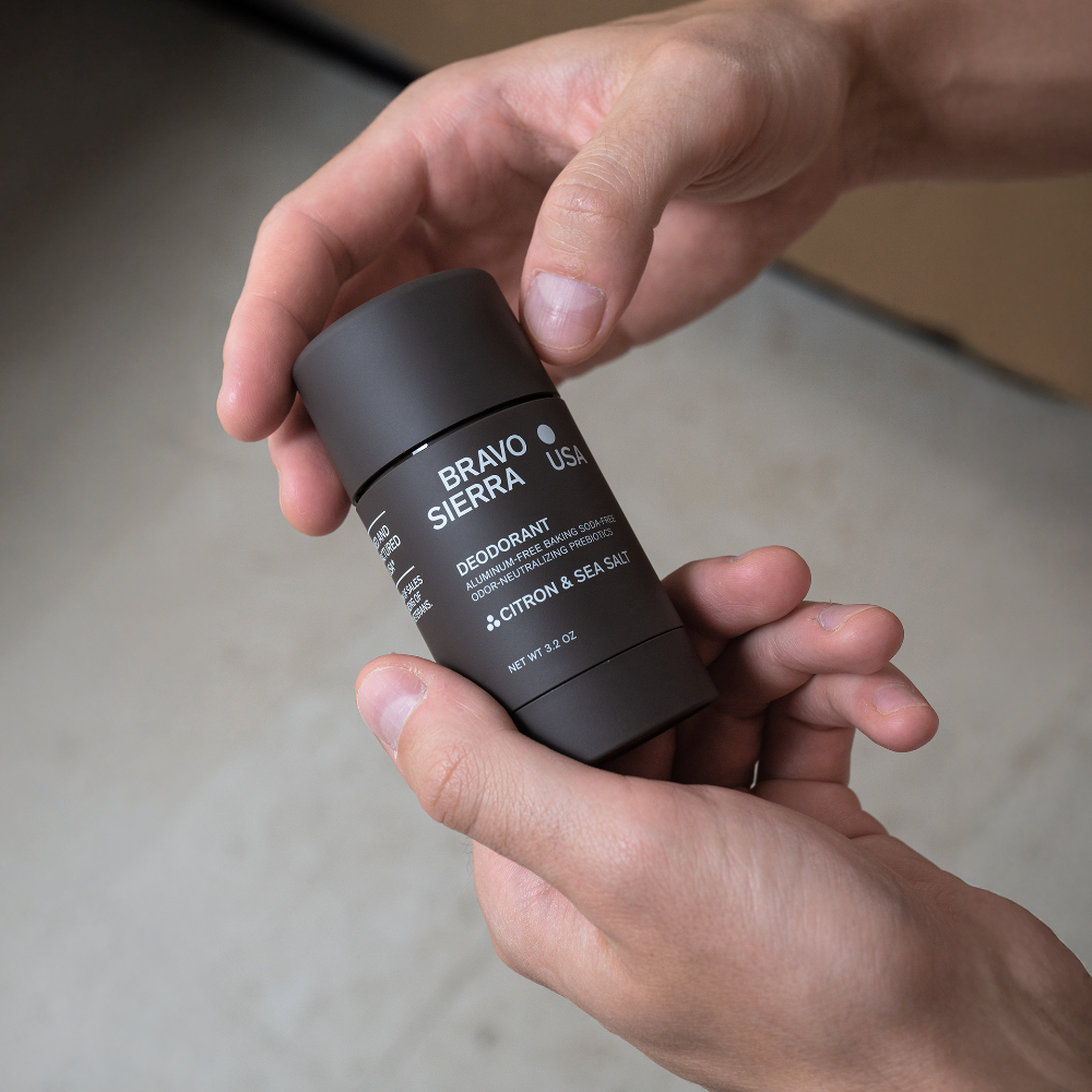 Hands holding Bravo Sierra Citron & Sea Salt Deodorant.