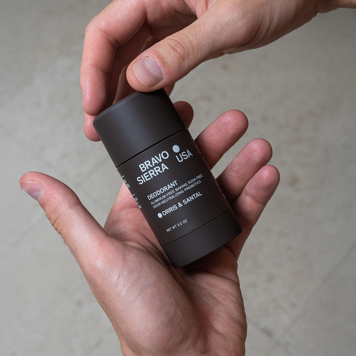 Hands holding Bravo Sierra's Orris & Santal Deodorant. 