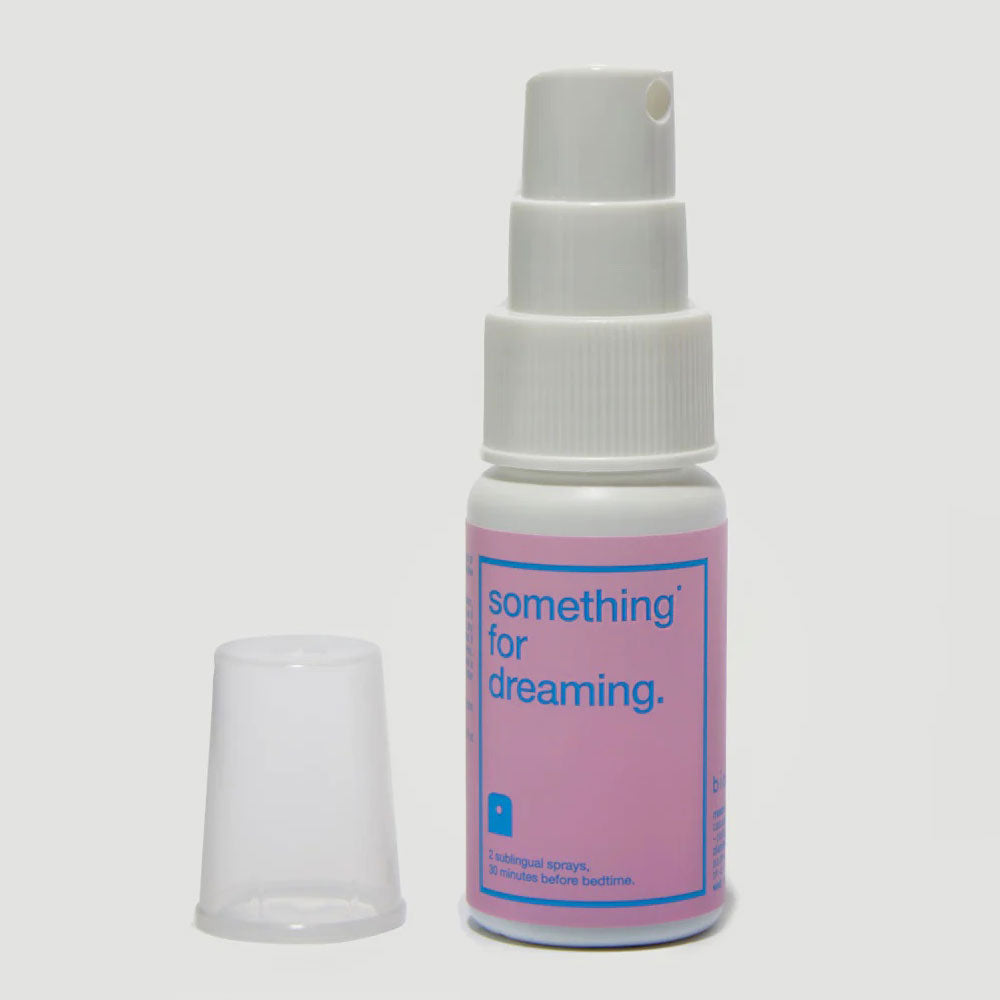 Pink and blue spray bottle of a product called 'something for dreaming.'