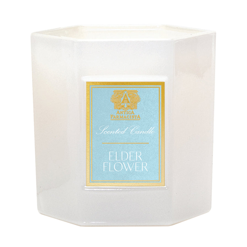 While Antica Farmacista Scented Candle, Elderflower, in front of a white background.