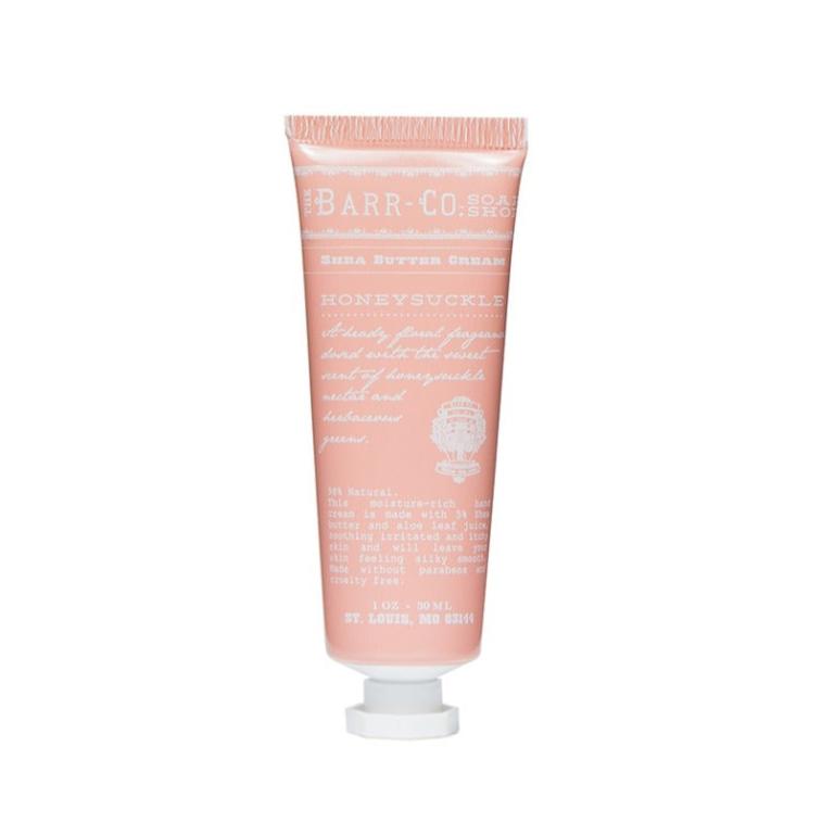 A pink tube of Barr Co. hand cream with white text and floral design, labeled 'Honeysuckle'.