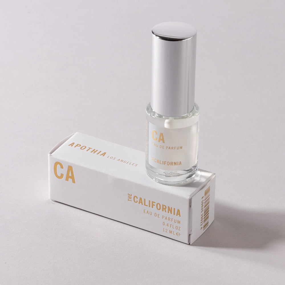 Perfume bottle on its box on a white background