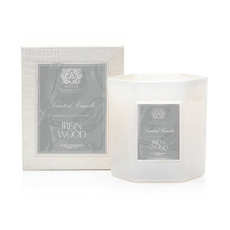 Iron Wood Candle next to its box.
