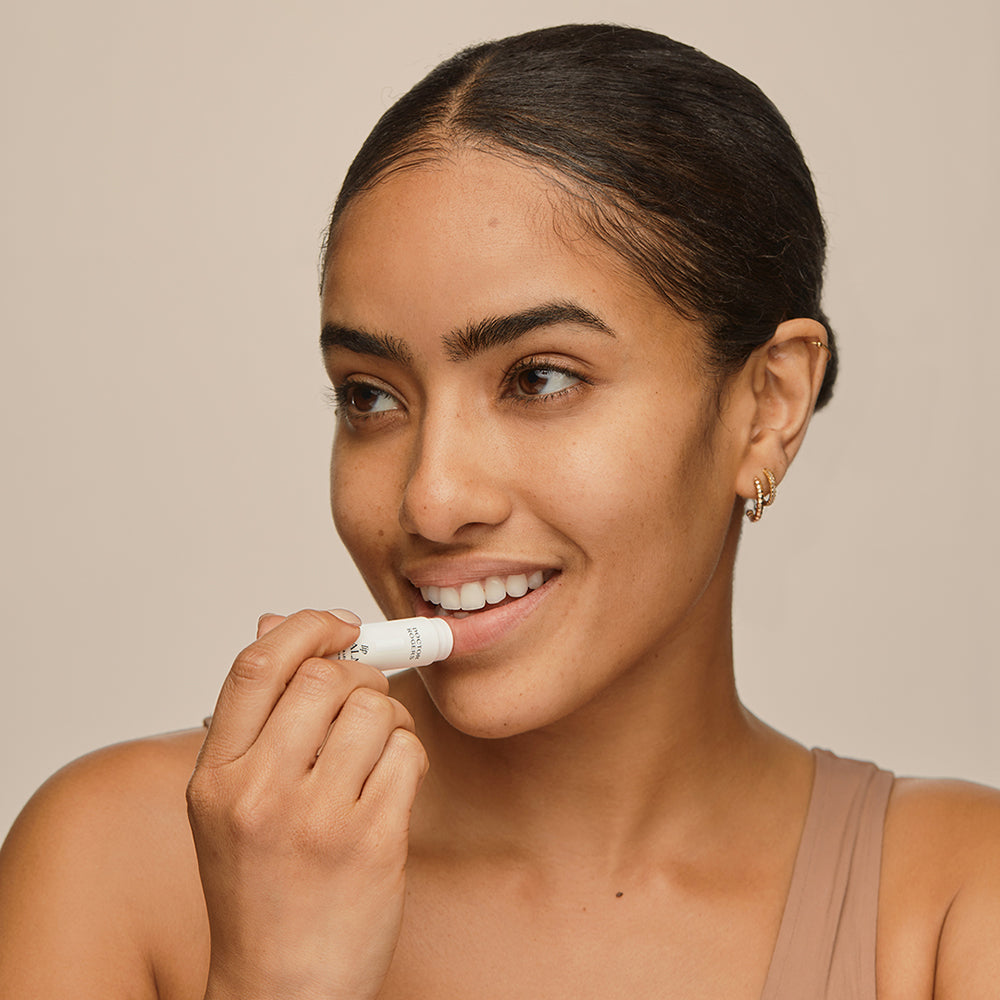 Woman applying Doctor Rogers Lip Balm