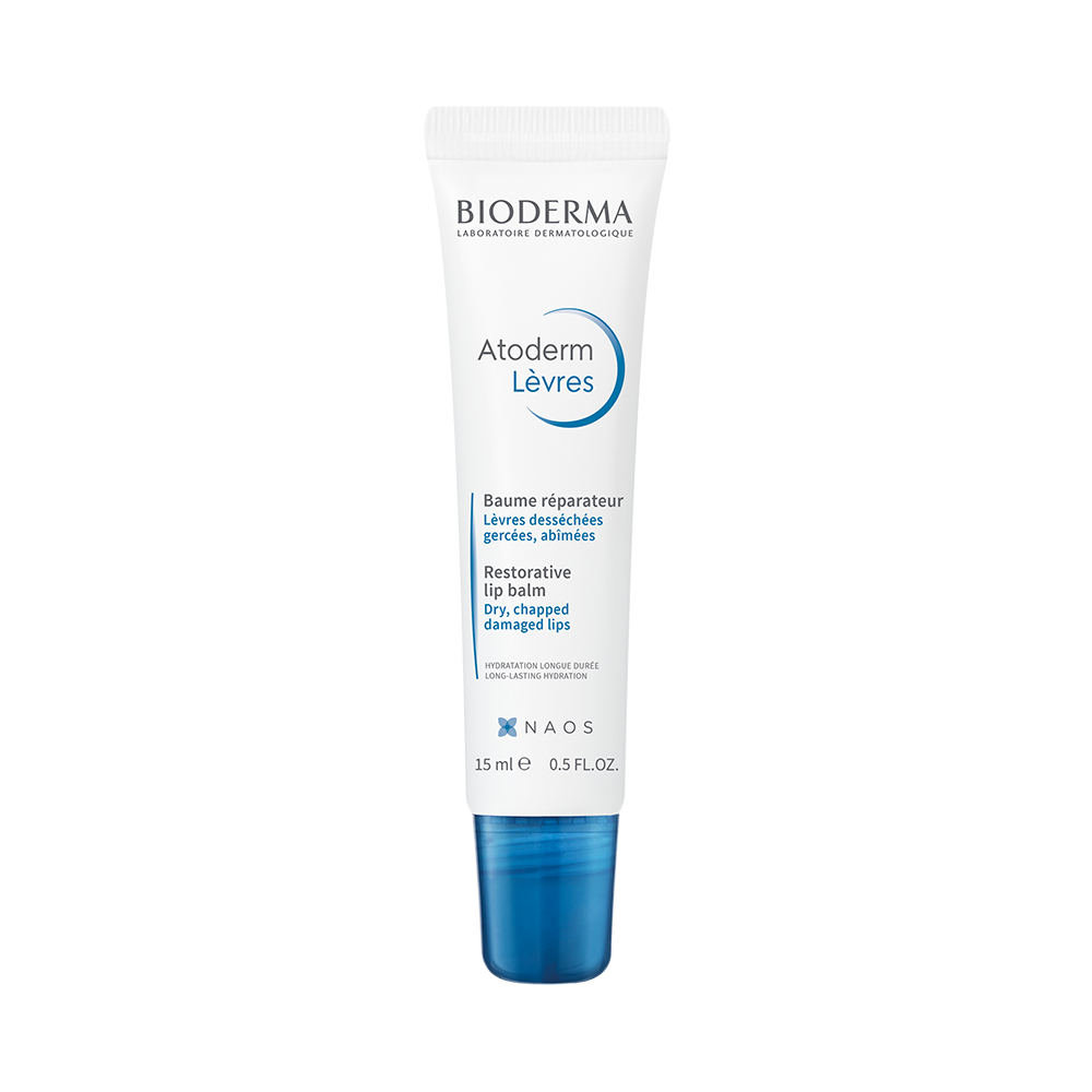 Bioderma Atoderm Lip Balm in a white tube with a blue cap, designed for moisturizing and nourishing the lips.