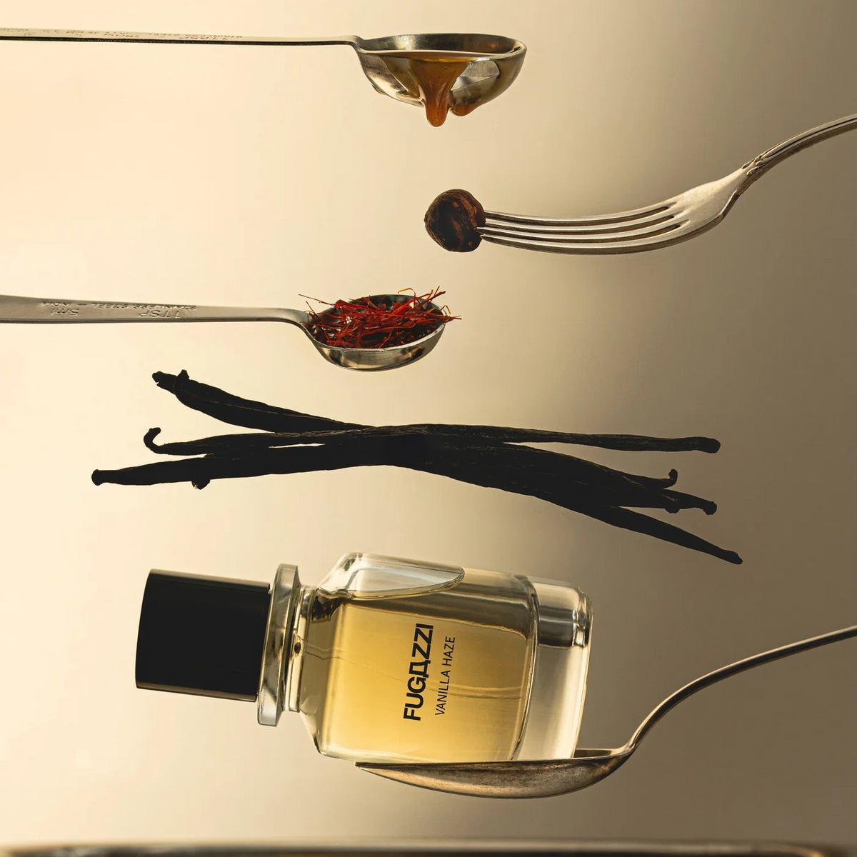 Fugazzi fragrance with forks and spoons with spices, honey and vanilla beans