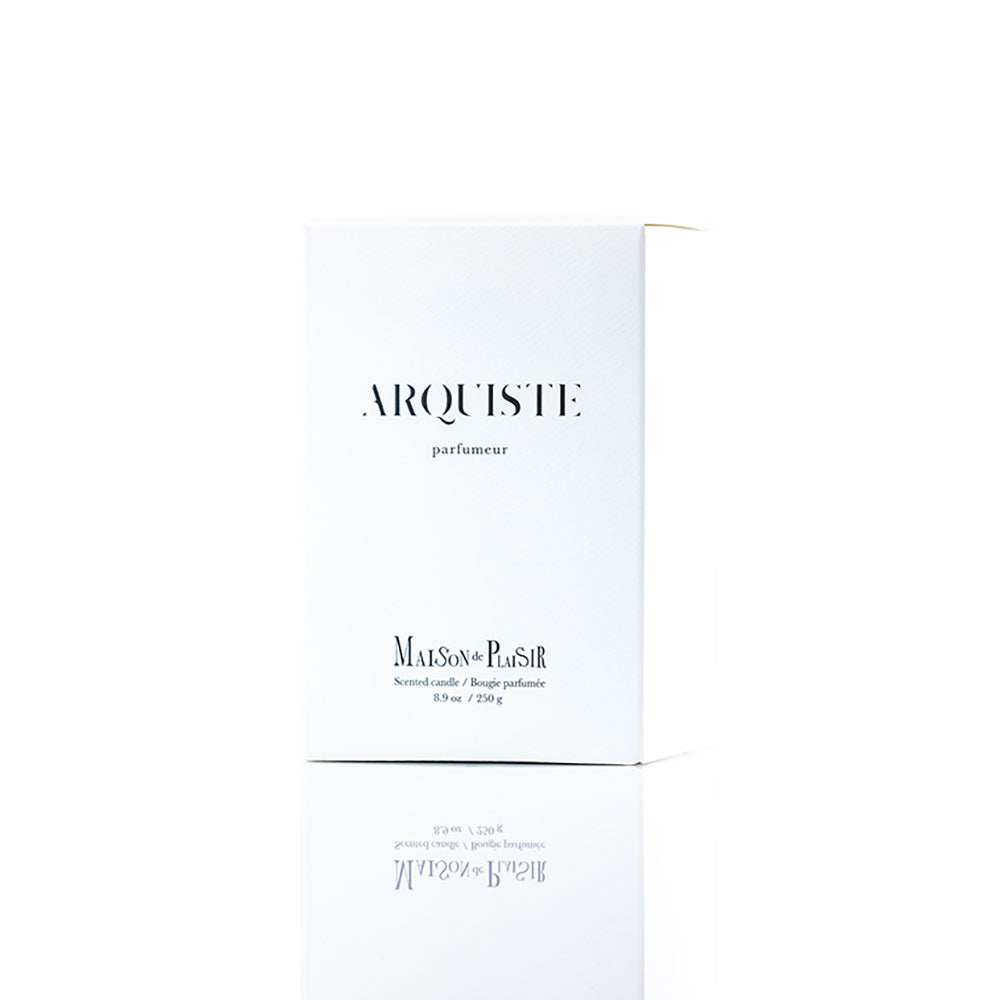 'MAISON DE PLAISIR ARQUISTE' candle box in front of a white background