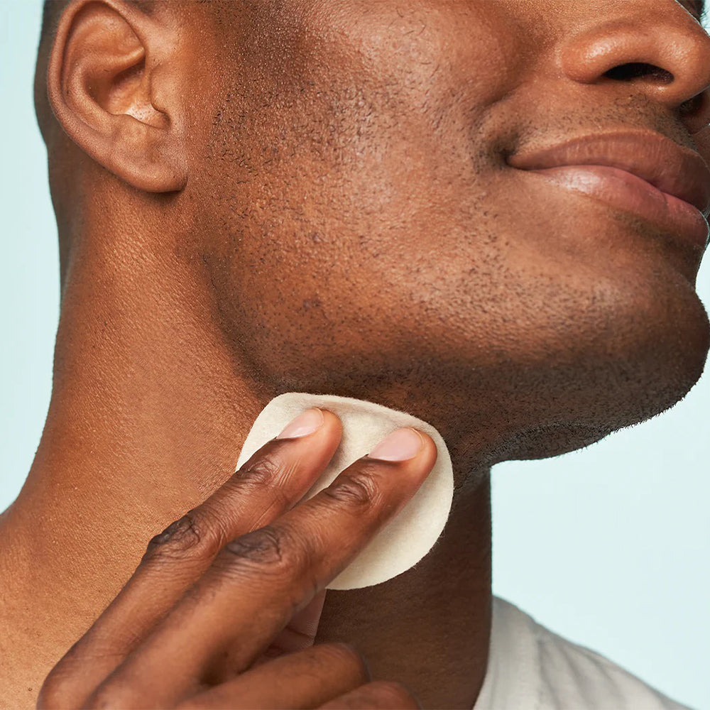 Man using Dr Dennis Gross Retinol +ferulic pad.
