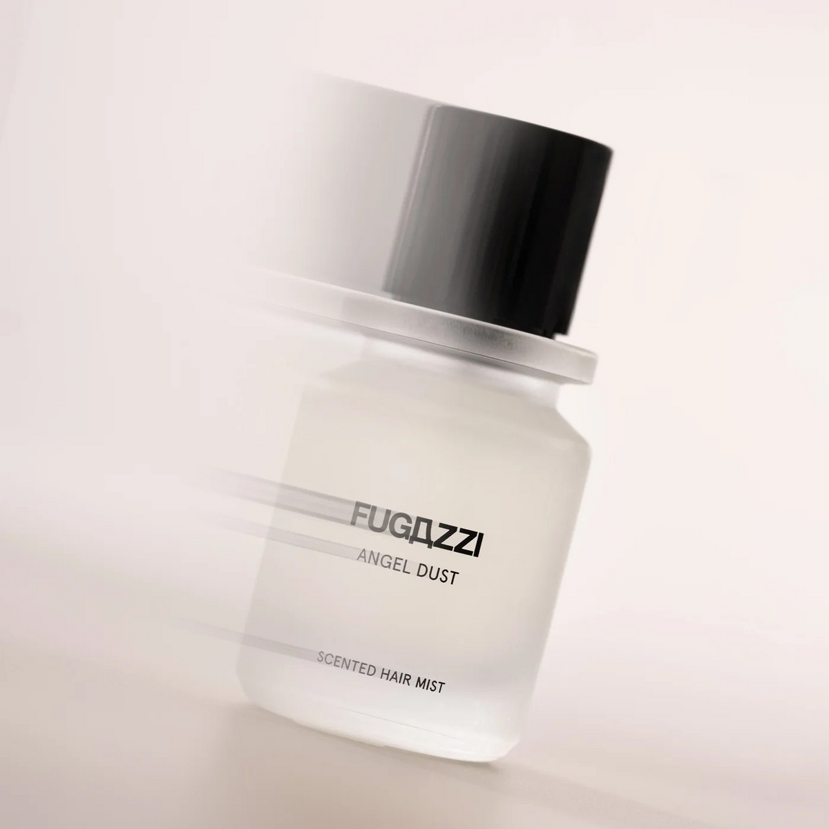 fugazzi scented hair mist bottle pictured with an action blur.