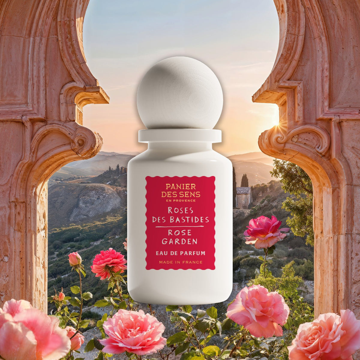 Rose Garden Perfume bottle with floral design against a scenic background