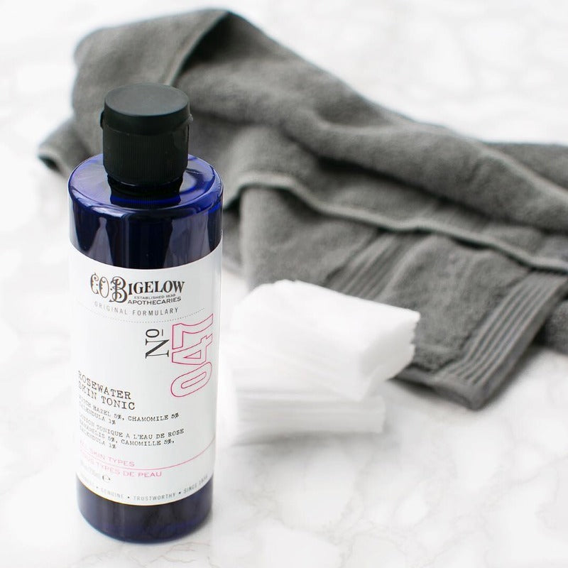 Co Bigelow Rosewater Skin Tonic alongside grey towel 